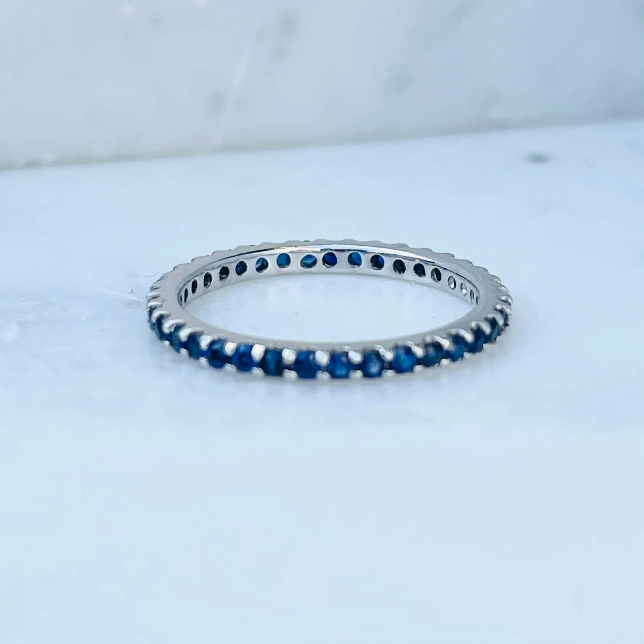 AD121BS Blue Sapphire Shared Prong Eternity Band