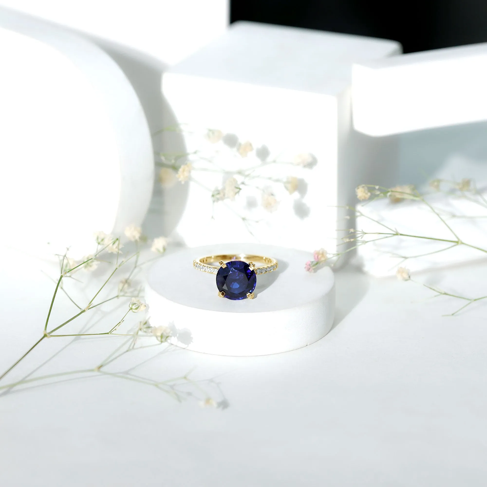 Created Blue Sapphire Solitaire Ring with Diamond Side Stones