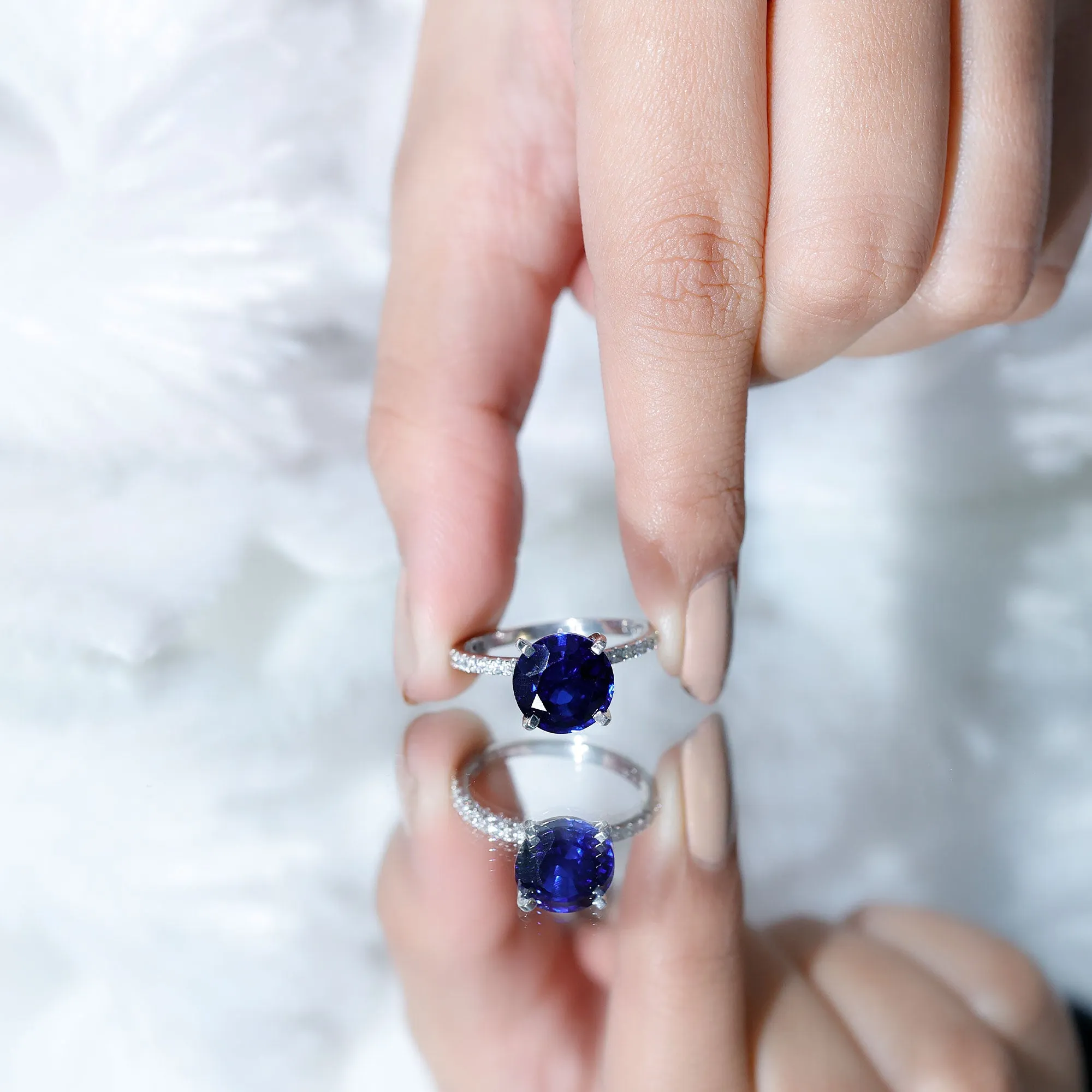 Created Blue Sapphire Solitaire Ring with Diamond Side Stones