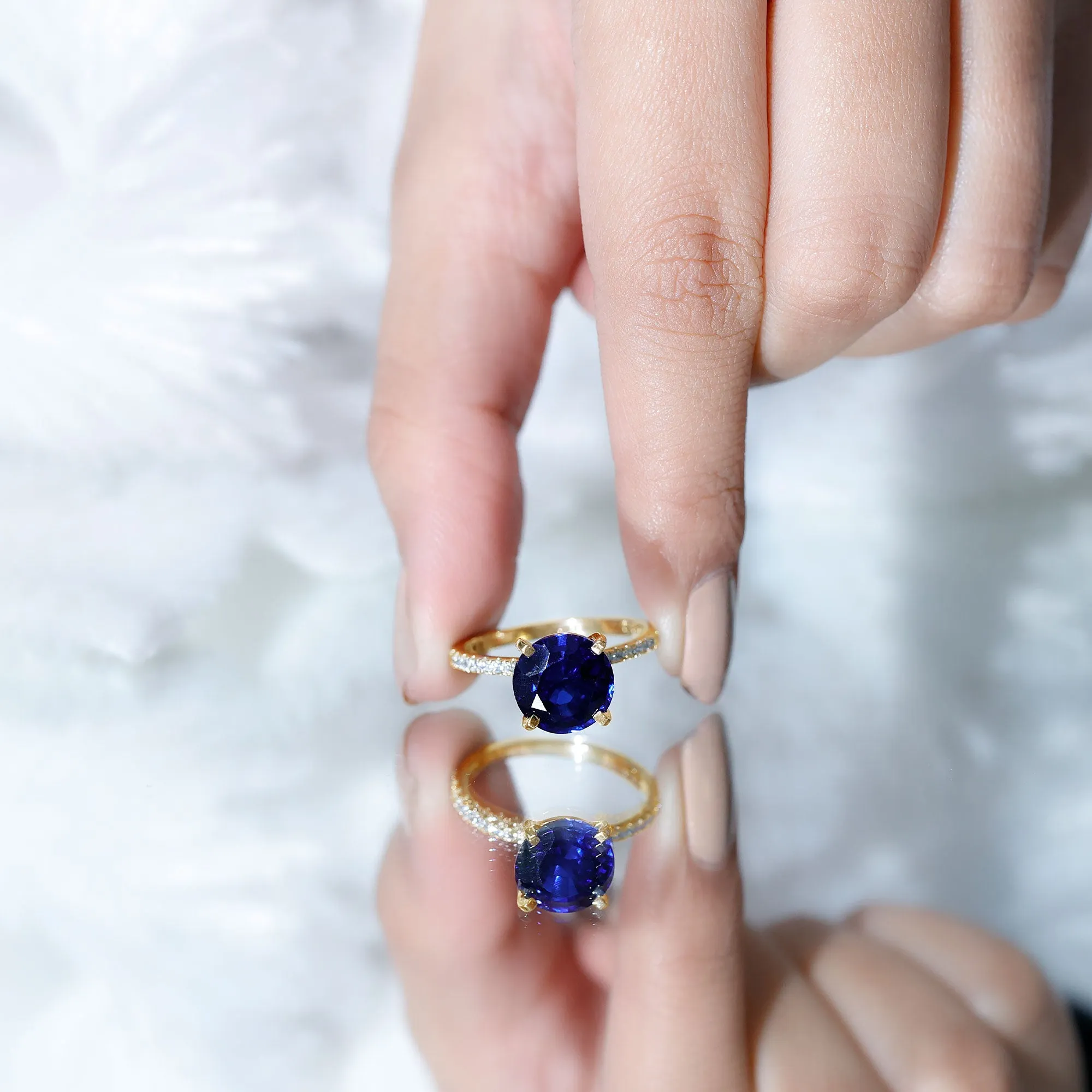 Created Blue Sapphire Solitaire Ring with Diamond Side Stones