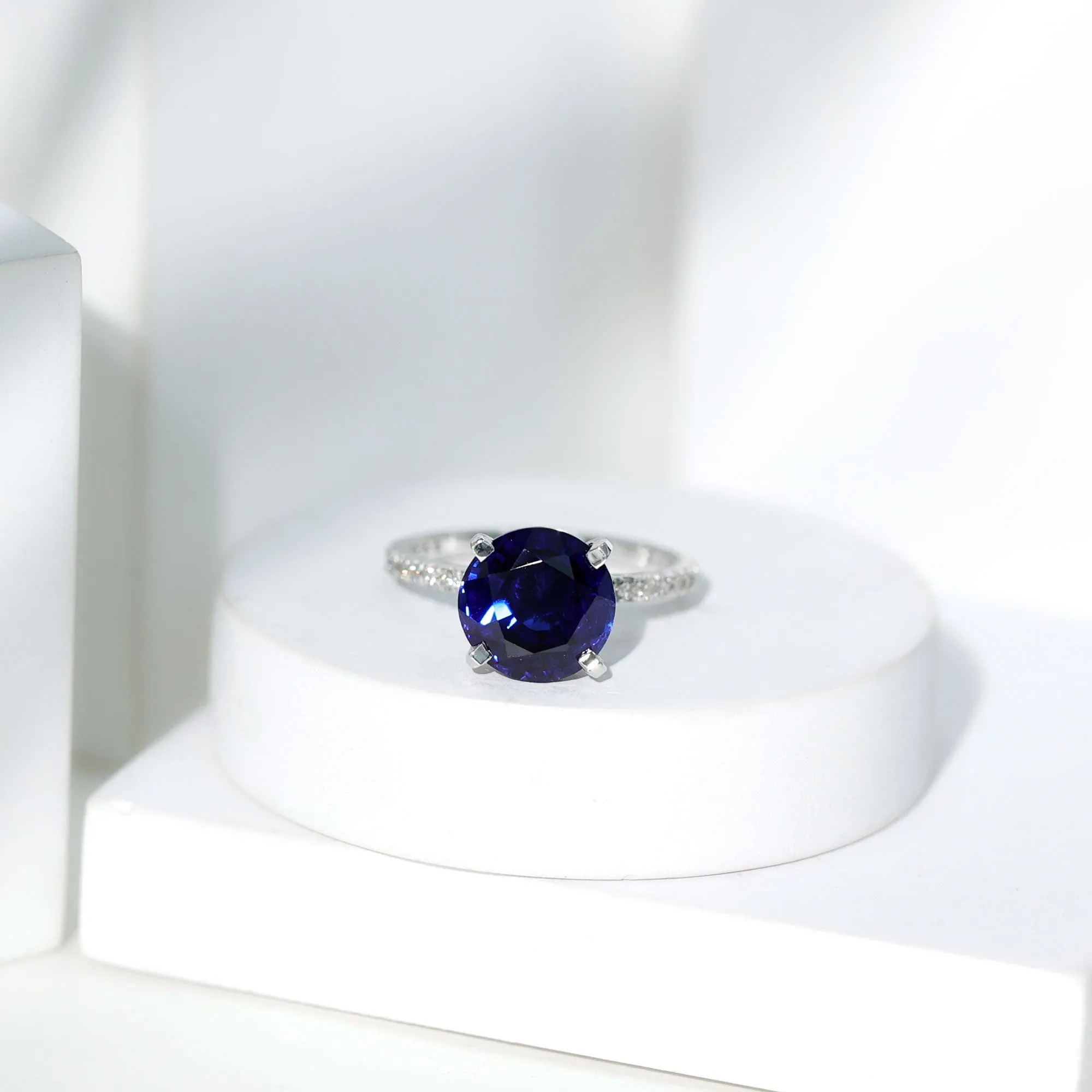 Created Blue Sapphire Solitaire Ring with Diamond Side Stones