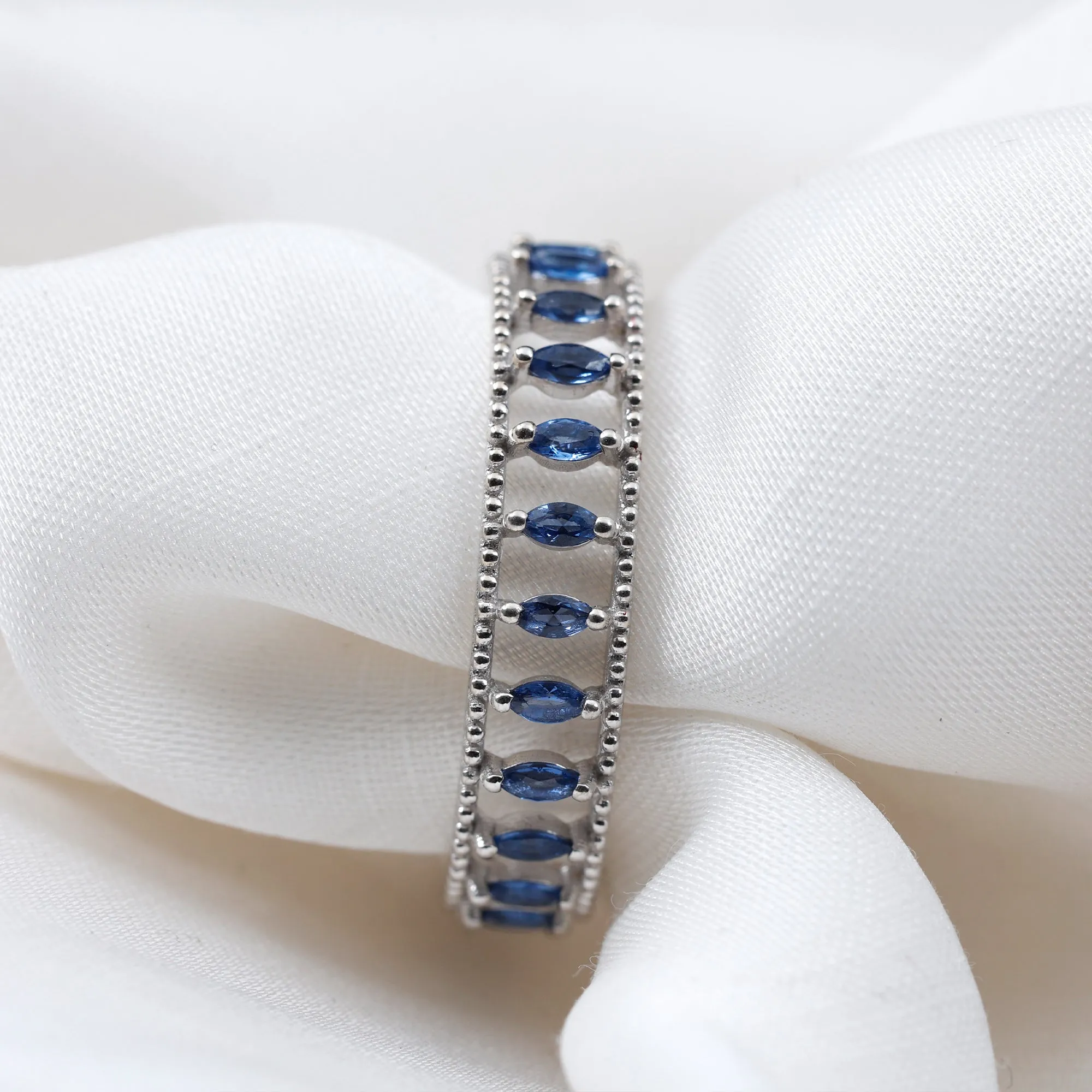 Marquise Cut Created Blue Sapphire Eternity Band with Beaded Detailing