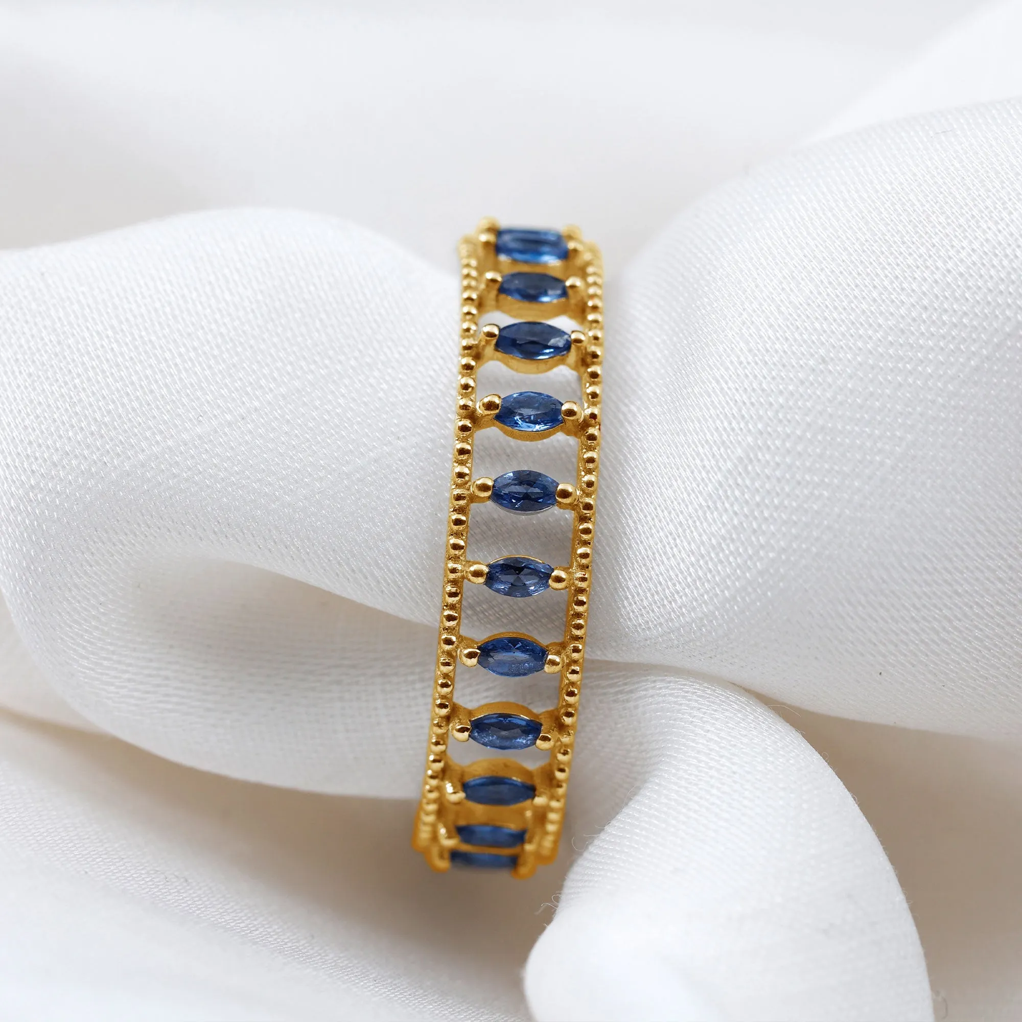 Marquise Cut Created Blue Sapphire Eternity Band with Beaded Detailing